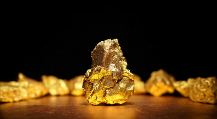 Closeup of a large gold nugget. stocks under $10