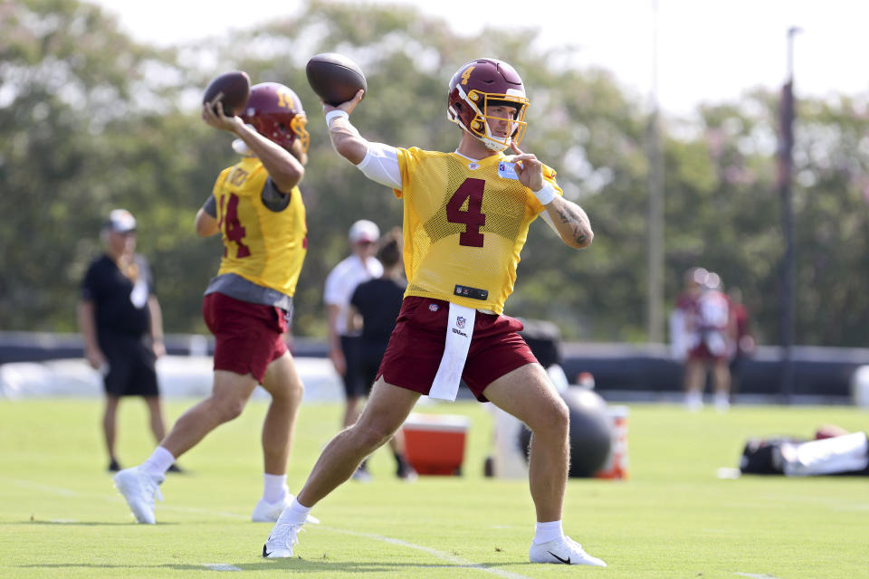 Washington Football Team quarterback Taylor Heinicke (4) throws a pass during NFL football practice in Richmond, Va., Wednesday, July 28, 2021. (AP Photo/Ryan M. Kelly)