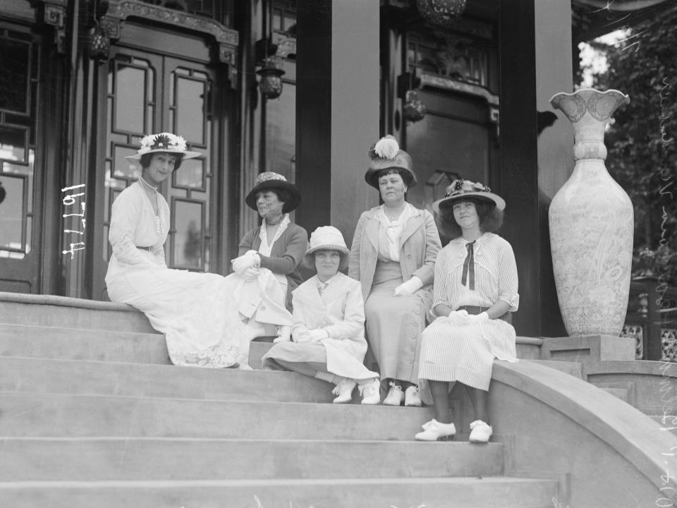 Some of the Vanderbilt women sit on the steps of a tea house in 1914.