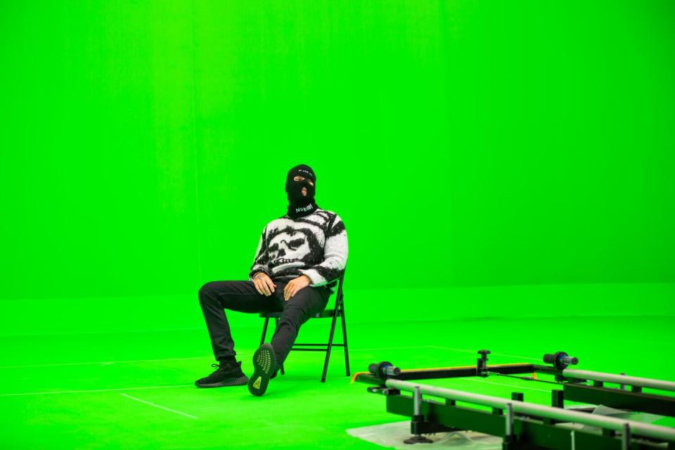 Avenged Sevenfold frontman M. Shadows films a solo in front of a massive green screen.