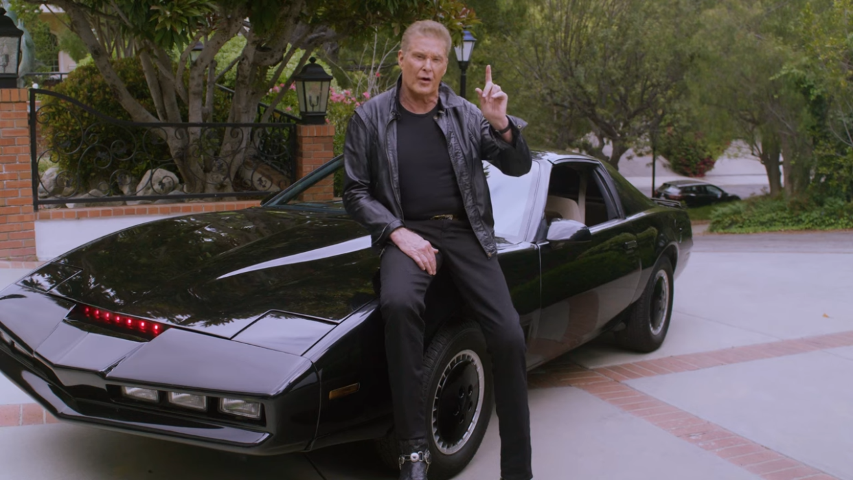  David Hasselhoff poses next to KITT, the car from Knight Rider. 