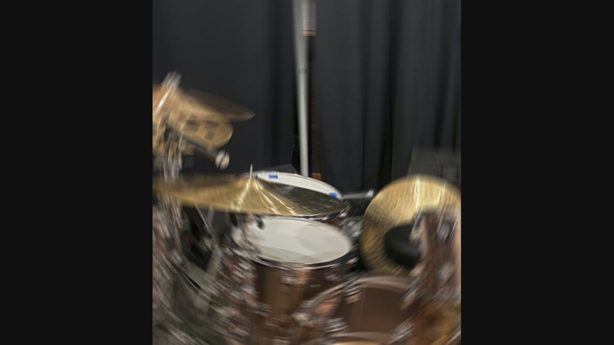  Blurred shot of DW drum kit with Paiste cymbals  