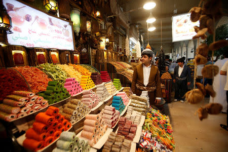 A Kurdish man sells sweets at a market in Erbil, Iraq, August 17, 2017. REUTERS/Azad Lashkari