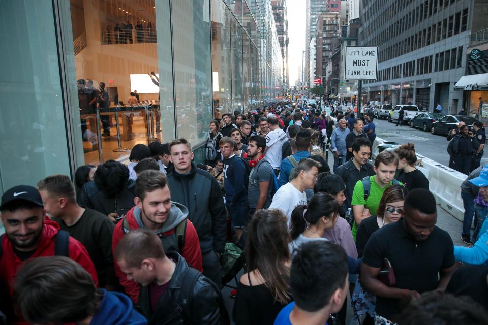 Customers wait in line for the doors to open at the Fifth Avenue Apple Store, Sept. 22, 2017, in New York City. The iPhone 8 and iPhone 8 Plus, as well as the updated Apple Watch and Apple TV, went on sale that day.