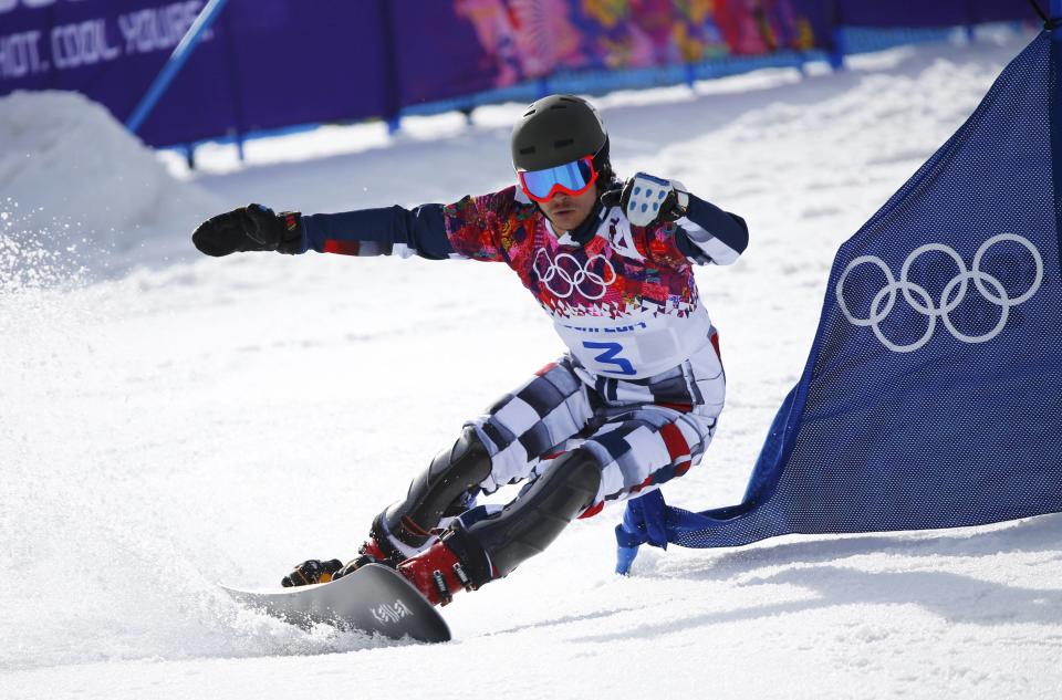 Russia's Vic Wild competes during the men's parallel snowboard finals at the 2014 Sochi Winter Olympic Games in Rosa Khutor February 22, 2014. REUTERS/Mike Blake (RUSSIA - Tags: OLYMPICS SPORT SNOWBOARDING)