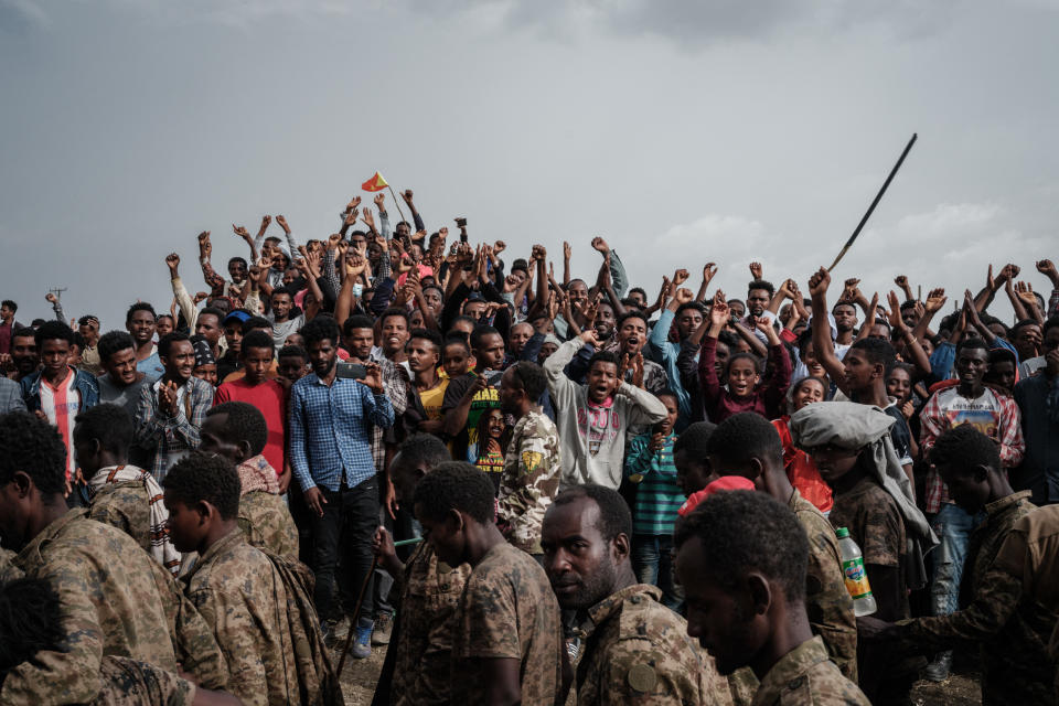 People react as captive Ethiopian soldiers walk towards Mekele Rehabilitation Center in Mekele, the capital of Tigray region, Ethiopia. (Yasuyoshi Chiba/AFP via Getty Images)