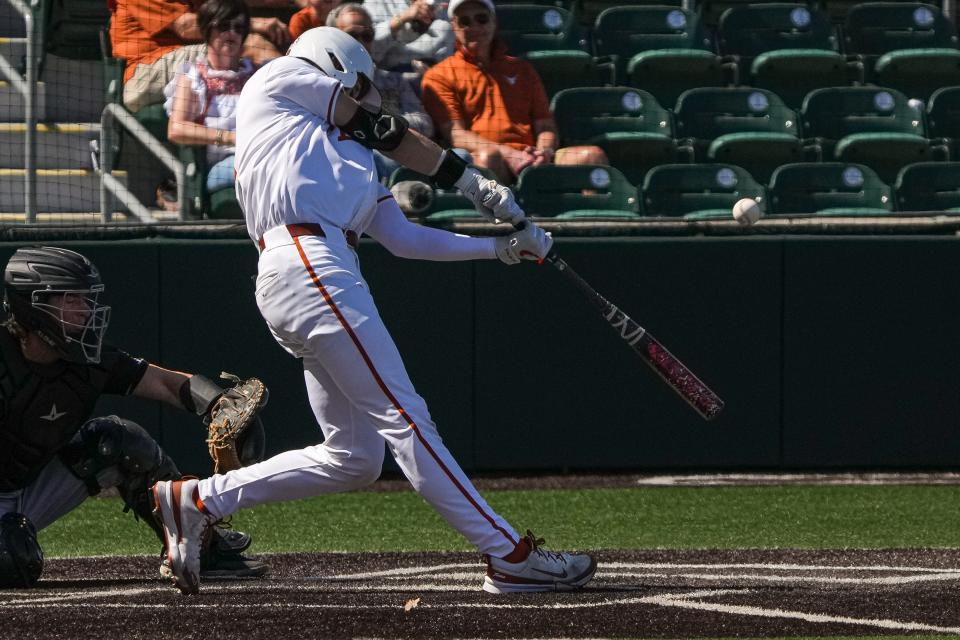 Texas' Jared Thomas takes a swing during the Longhorns' 7-0 win over Cal Poly on Sunday at UFCU Disch-Falk Field. He's off to a hot start this season, hitting .571 with five doubles, 12 runs scored and one home run.