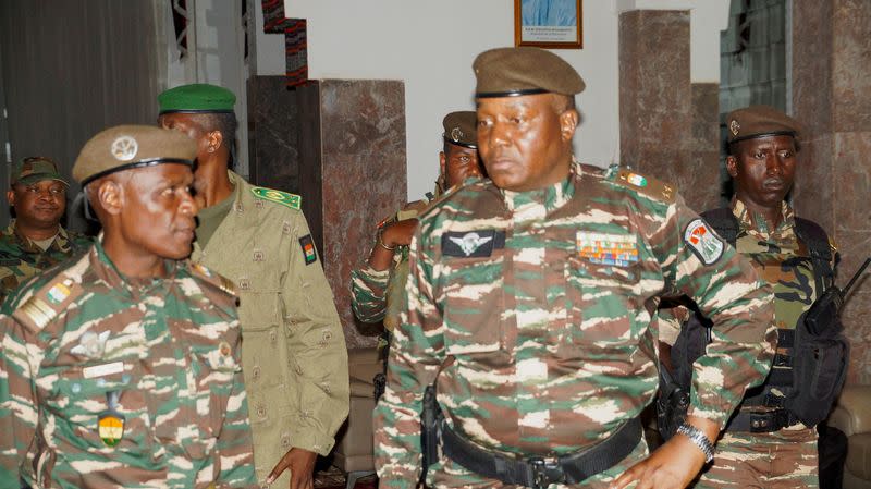 FILE PHOTO: FILE PHOTO: General Abdourahmane Tiani, who was declared as the new head of state of Niger by leaders of a coup, meets ministers in Niamey