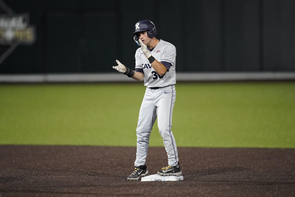 Xavier short stop Jack Housinger (38) celebrates a double against Oregon while standing on second base during the third inning of an NCAA college baseball tournament regional championship game, Sunday, June 4, 2023, in Nashville, Tenn. (AP Photo/George Walker IV)