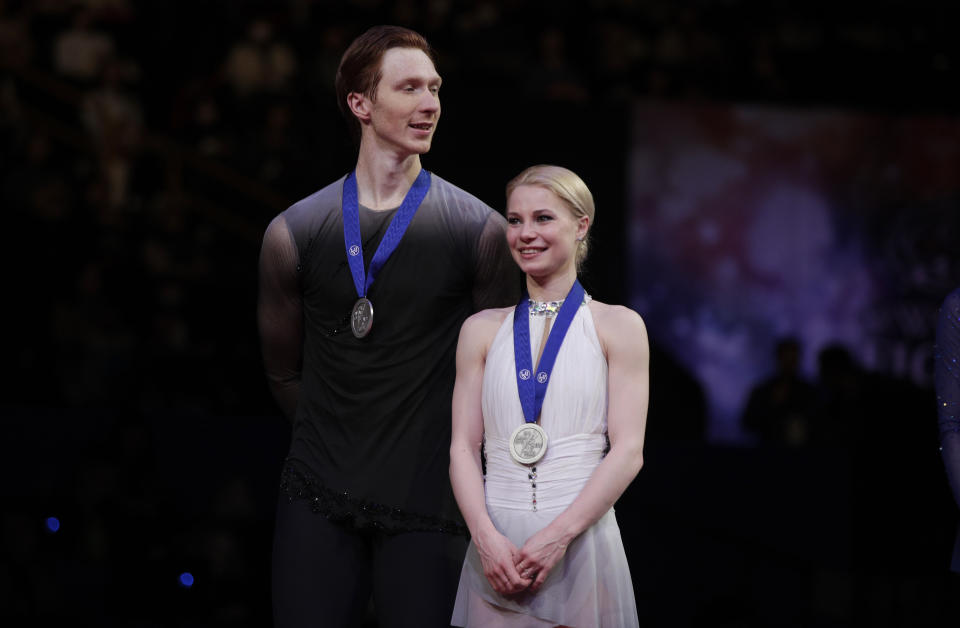 Russia's Evgenia Tarasova and Vladimir Morozov stand with their silver medals for the pairs free skate during the ISU World Figure Skating Championships at Saitama Super Arena in Saitama, north of Tokyo, Thursday, March 21, 2019. (AP Photo/Andy Wong)