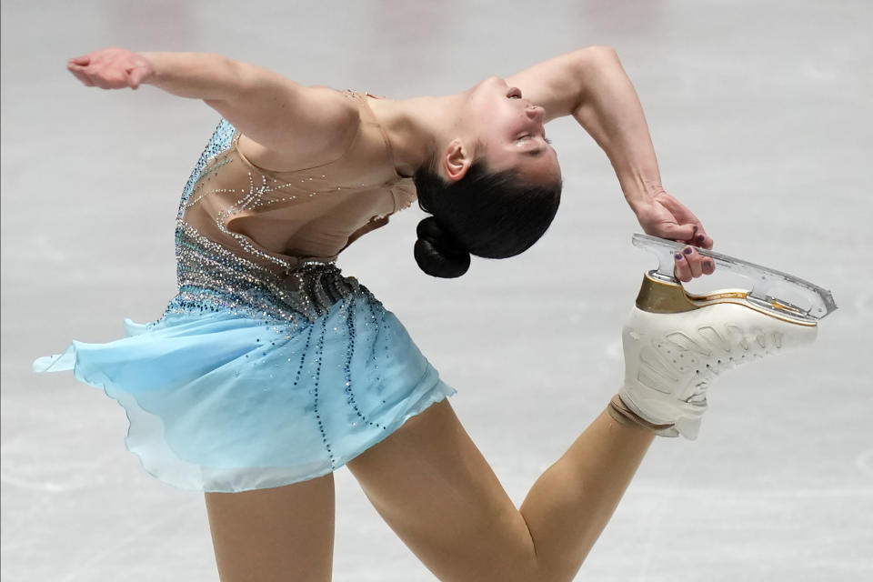 FILE - Alysa Liu, of the United States, performs during the women's free skating at the ISU Grand Prix of Figure Skating NHK Trophy competition in Tokyo, Japan, Nov. 13, 2021. Liu's father, Arthur Liu, left his home country in his 20s as a political refugee because he had protested the Communist government following the 1989 Tiananmen Square massacre. Now his Chinese-American daughter is set to make her Olympic debut in the women's singles competition. (AP Photo/Shuji Kajiyama, File)