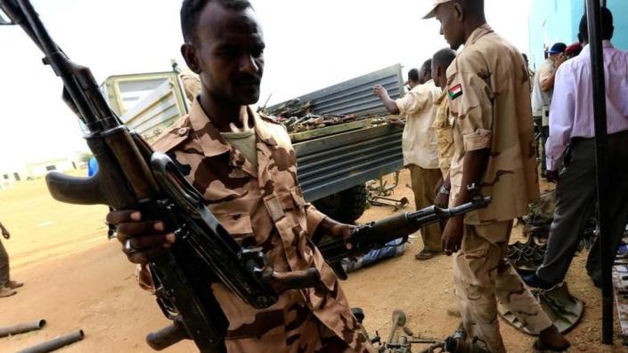 Rapid Support Forces upload disarmed weapons for display during Sudanese President Omar al-Bashir's visit to the war-torn Darfur region at the Rapid Support Forces headquarters in Umm Al-Qura, Darfur, Sudan on 23 September 2017