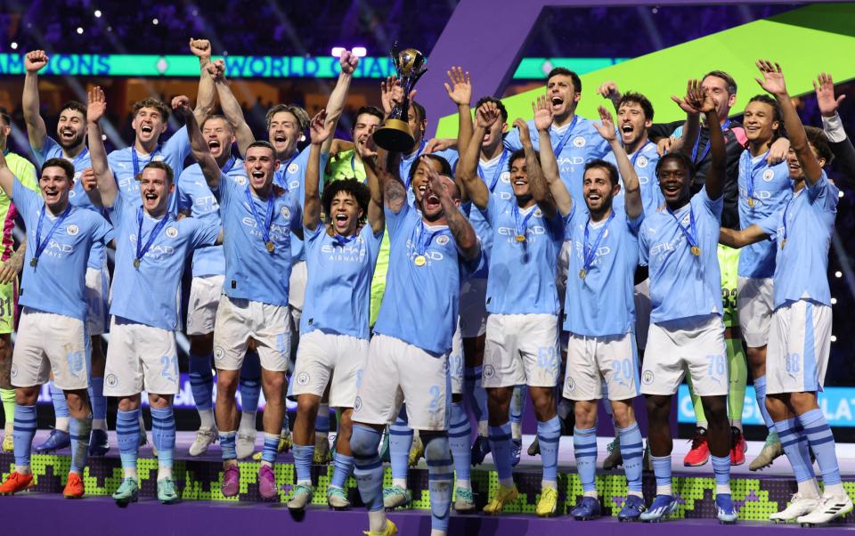 Manchester City players celebrate with their winning trophy at the end of the FIFA Club World Cup 2023 football final match against Brazil's Fluminense at King Abdullah Sports City Stadium in Jeddah