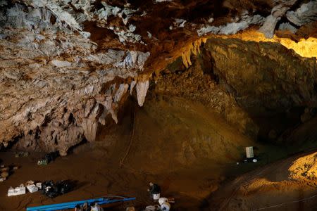 A soldier sits in the Tham Luang caves during a search for 12 members of an under-16 soccer team and their coach, in the northern province of Chiang Rai, Thailand, June 27, 2018. REUTERS/Soe Zeya Tun