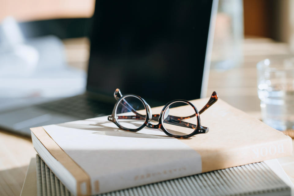 glasses on top of a book