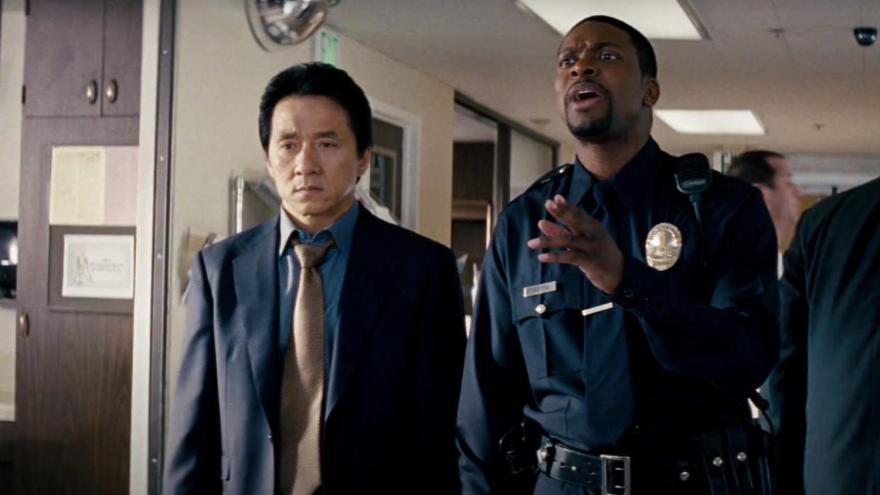  Jackie Chan and Chris Tucker standing in a hospital hallway during a conversation in Rush Hour 3. 