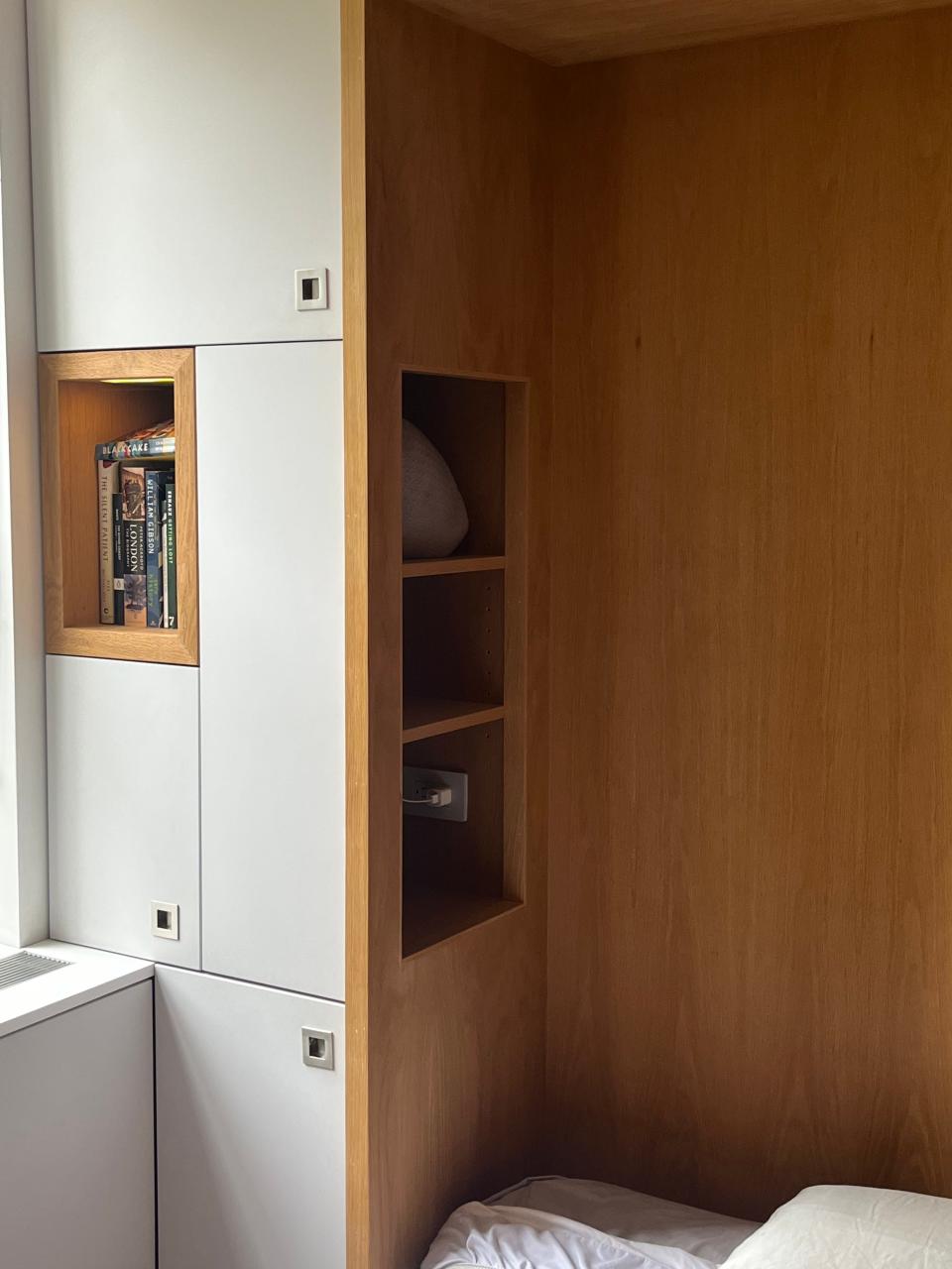 One of the shelving units built into the Murphy bed set-up. 