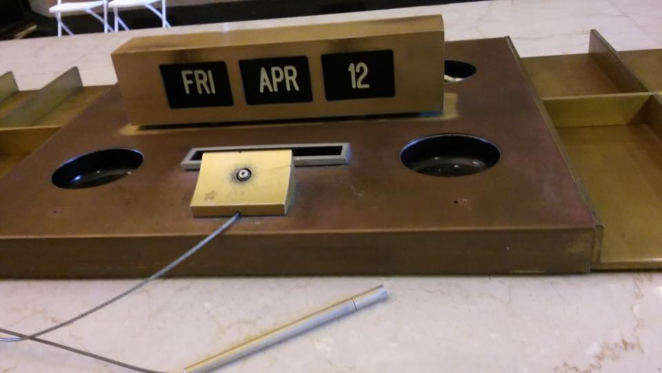 A desk plate in the building's lobby shows Friday, April 12, 2013, the last day Bank of America operated in the building. (Rachel Nunes - File)