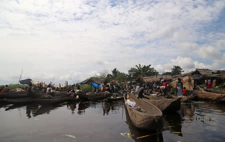 Fishing boats are seen docked on the Congo River during the vaccination campaign aimed at beating an outbreak of Ebola in the port city of Mbandaka, Democratic Republic of Congo May 22, 2018. REUTERS/Kenny Katombe