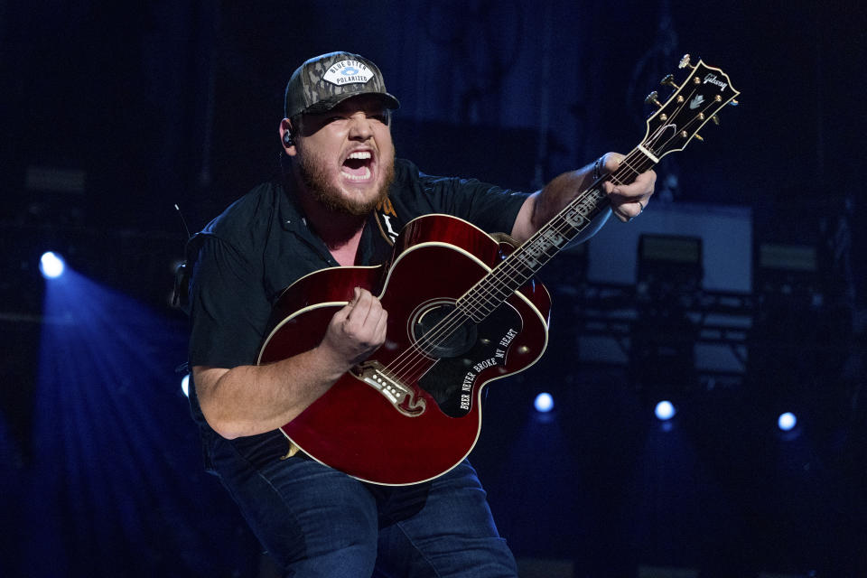 FILE - Luke Combs performs during CMA Fest 2022 in Nashville, Tenn., on June 11, 2022. Comb's latest album, "Growin' Up," releases Friday, July 1. (Photo by Amy Harris/Invision/AP, File)