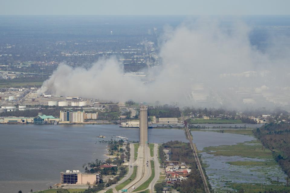 A chemical fire burns at a facility during the aftermath of Hurricane Laura Thursday, Aug. 27, 2020, near Lake Charles, La. (AP Photo/David J. Phillip)