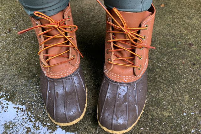 <p>People / Kayla Kitts</p> Shopping editor Kayla Kitts wears L.L.Bean boots during a downpour.