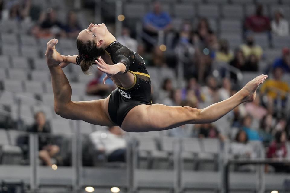 Minnesota's Lexy Ramler competes on the floor exercise during the NCAA women's gymnastics championships, Thursday, April 14, 2022, in Fort Worth, Texas. (AP Photo/Tony Gutierrez)