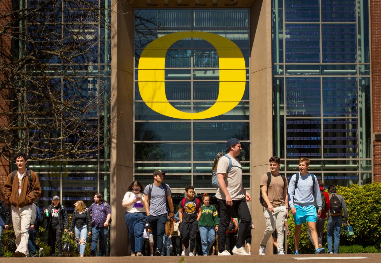 Students walk between classes near the Lillis Business Complex on the campus of the University of Oregon in Eugene. 