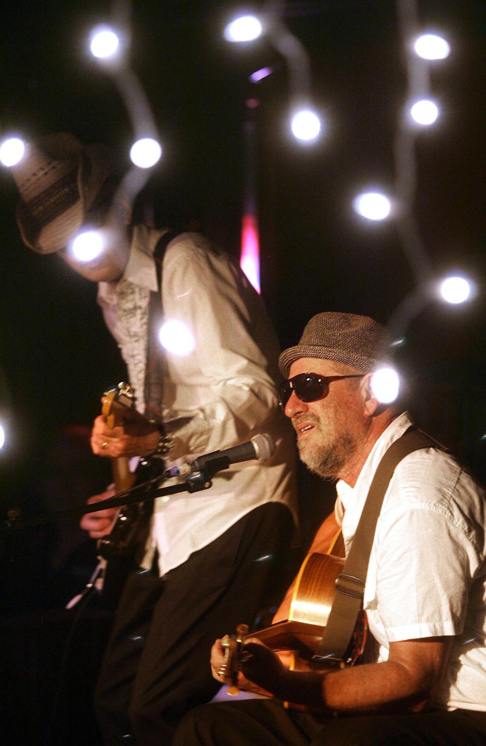 In this photo from 2011, artist Greg Brown performs at The Mill.