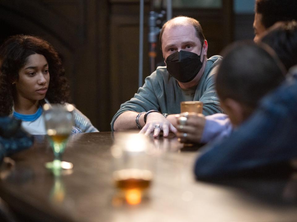 Mike Flanagan (center, in mask) with cast members on the set of "The Midnight Club."