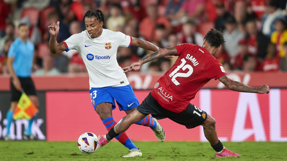 Barcelona's Jules Koundé dribbles with the ball against Mallorca. - Cristian Trujillo/Quality Sport Images/Getty Images