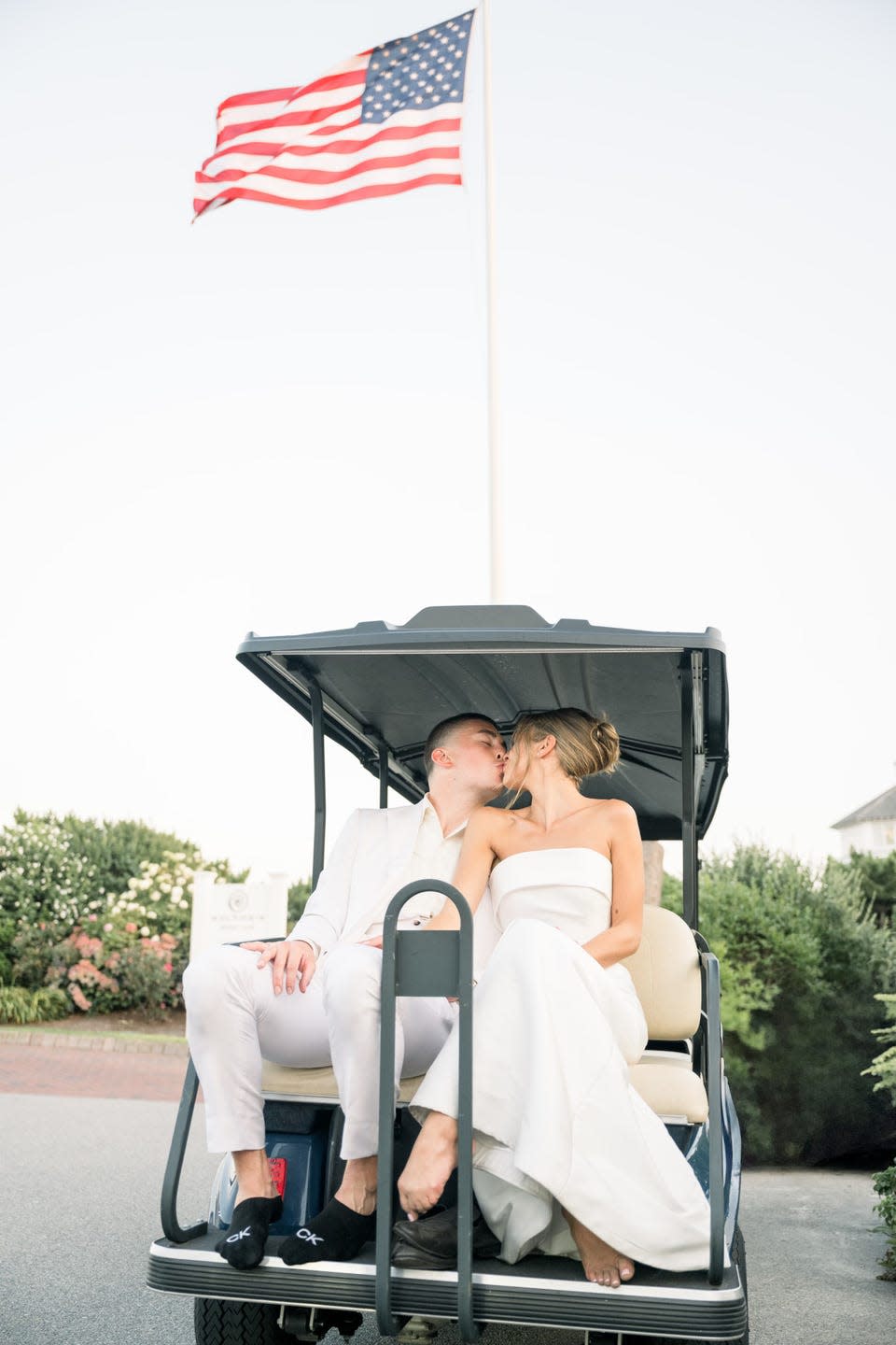 a couple on a golf cart