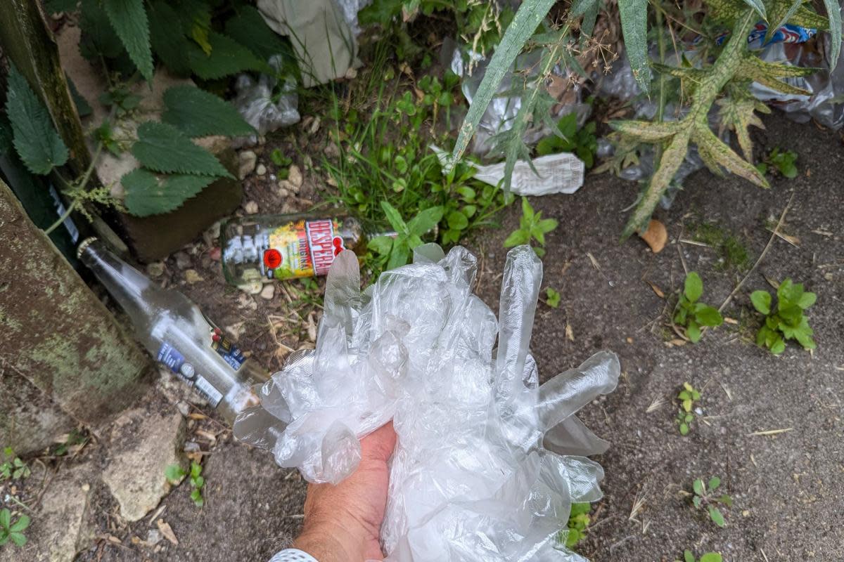 Picture of plastic gloves on the footpath <i>(Image: David Brimson)</i>