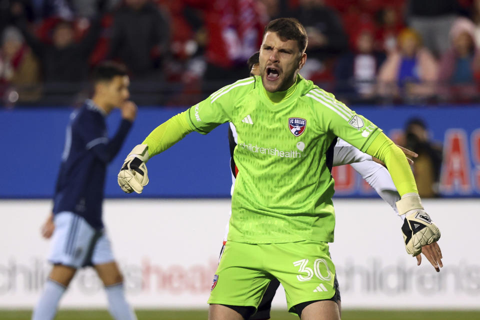 Dallas goalkeeper Maarten Paes (30) reacts after stopping a penalty shot by Sporting Kansas City in the second half of an MLS soccer match, Saturday, March 18, 2023, in Frisco, Texas. (AP Photo/Richard W. Rodriguez)