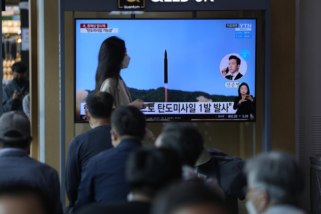 People watch a TV screen showing a news program reporting about North Korea's missile launch with file footage, at a train station in Seoul, South Korea, Wednesday, May 4, 2022. (AP Photo/Lee Jin-man)