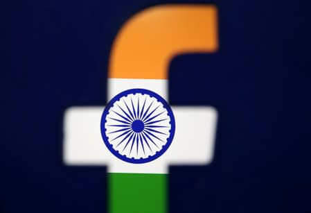 India's flag is seen through a 3D printed Facebook logo in this illustration picture