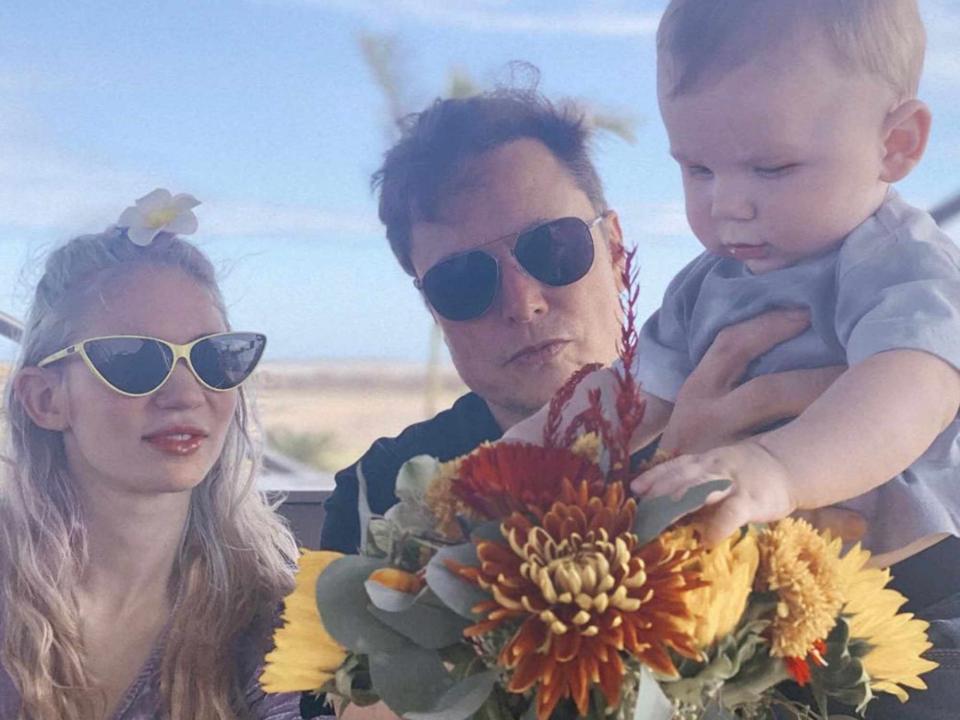 <p>Elon Musk Twitter </p> Grimes and Elon Musk with their son X in 2021.