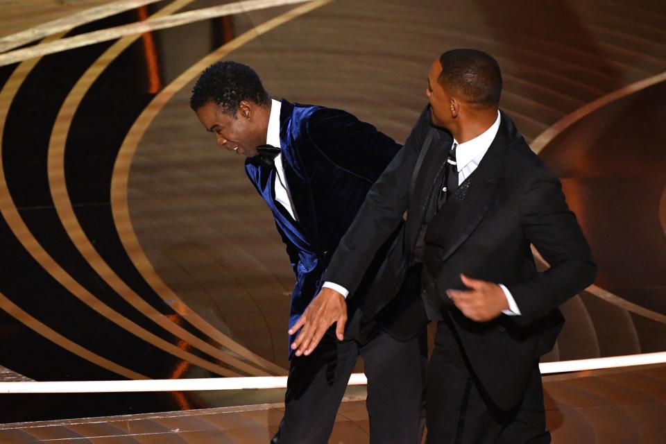 Will Smith slaps Chris Rock onstage during the 94th Oscars 
