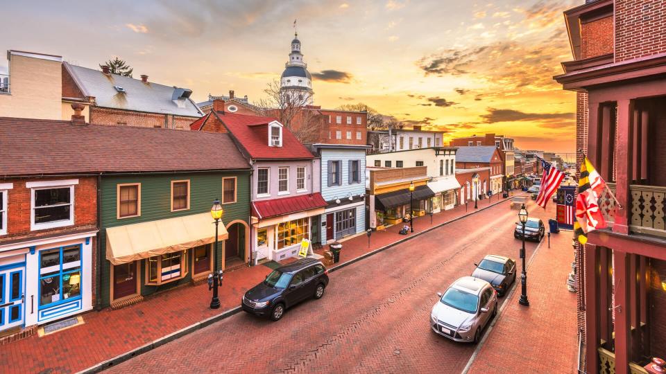 Annapolis, Maryland, USA downtown view over Main Street with the State House at dawn.