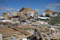 <p>A neighbourhood destroyed by a tornado is seen in Dunrobin, Ont., west of Ottawa, on Saturday, Sept. 22, 2018. The storm tore roofs off of homes, overturned cars and felled power lines in the Ottawa community of Dunrobin and in Gatineau, Que. (Photo from Justin Tang/The Canadian Press) </p>