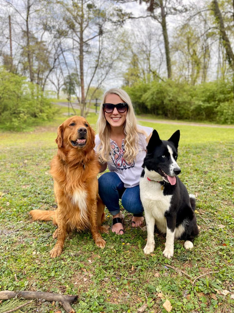 Hannah Goldsby, creator of K and M Collars, with her models: Midas, left, and Kona.
