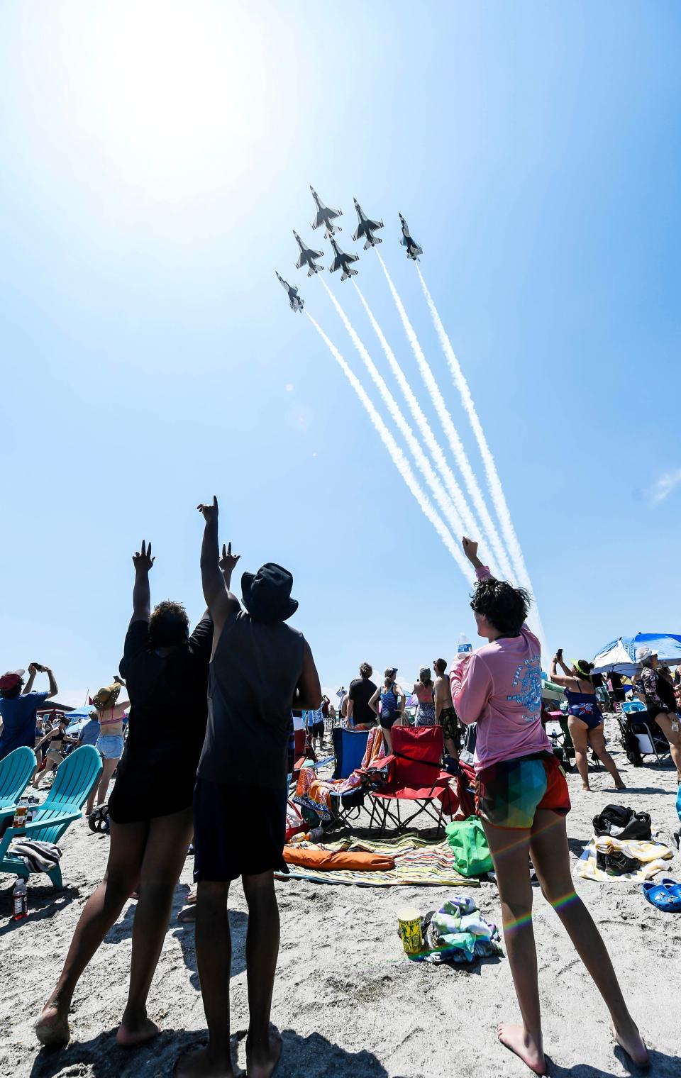 Thousands crowd the shore along Cocoa Beach as the Thunderbirds make their entrance during the Cocoa Beach Air Show Saturday, April 15, 2023.  Craig Bailey/FLORIDA TODAY via USA TODAY NETWORK