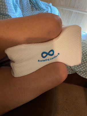 A knee pillow designed to help side sleepers rest more comfortably