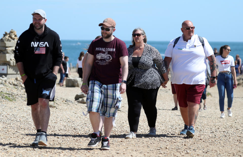 Tim Dunn (far right) and his wife Tracey Dunn (second right), as they gather with friends and family at Portland Bill to scatter his son's ashes in his favourite place in Weymouth, Dorset, a month before the anniversary of his death.