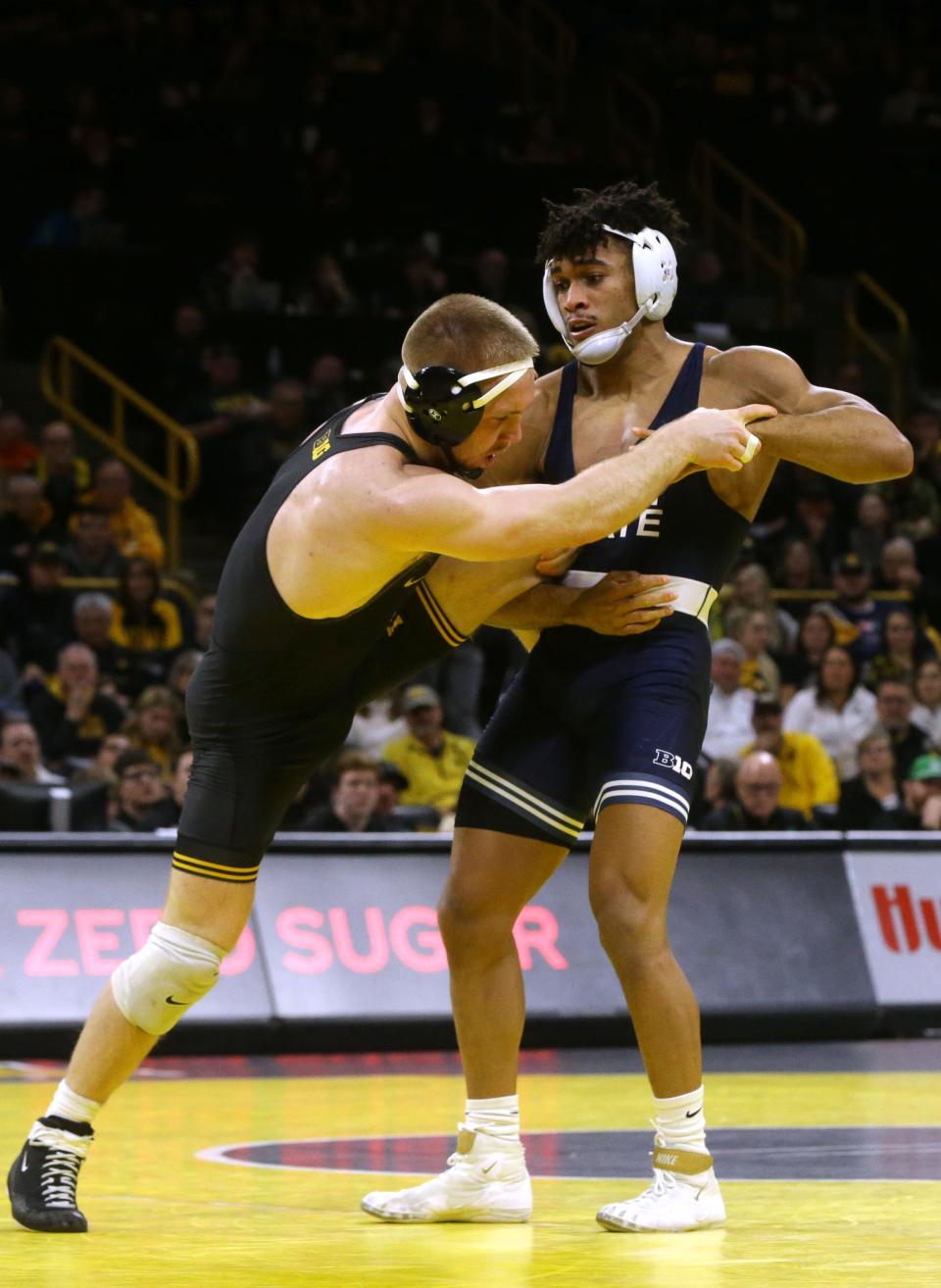 Iowa’s Patrick Kennedy, left, wrestles Penn State’s Carter Starocci in a 174-pound match at Iowa's Carver-Hawkeye Arena on Feb. 9. Starocci appeared to injure his right knee during the Nittany Lions' home dual vs. Edinboro University on Feb. 25. However, the 2019 Cathedral Prep graduate indicated in a March 1 social media post that he expects to participate in this weekend's Big Ten Conference tournament at College Park, Maryland.