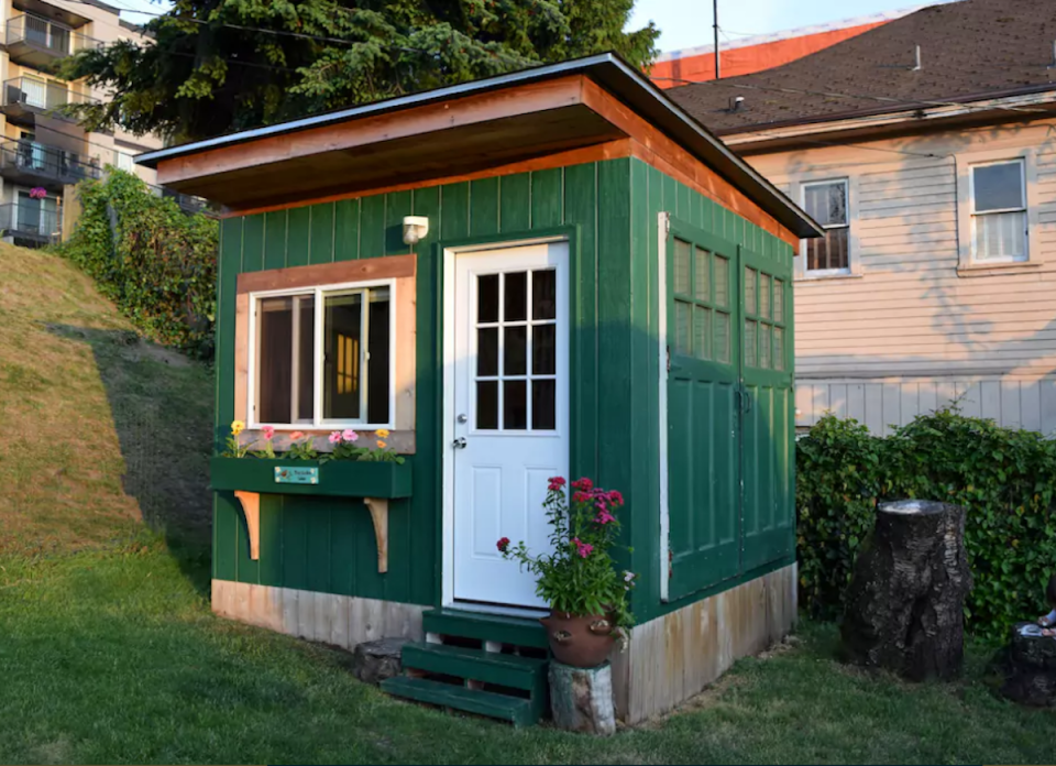 <body> <p>This tiny house isn't much bigger than a backyard tool shed, but it's infinitely more stylish. Cherrywood floors topped with an oak bed frame and <a rel="nofollow noopener" href=" http://www.bobvila.com/slideshow/8-nightstands-you-don-t-need-to-buy-48208?bv=yahoo" target="_blank" data-ylk="slk:nightstand;elm:context_link;itc:0;sec:content-canvas" class="link ">nightstand</a> lend warmth and comfort to the cabin even on cool Seattle nights. The backyard site, a haven for frolicking rabbits and chickens, offers both privacy and diversion.</p> <p><strong>Related: <a rel="nofollow noopener" href=" http://www.bobvila.com/slideshow/build-your-own-greenhouse-11-easy-to-assemble-kits-45789#.WD-s56IrKRs?bv=yahoo" target="_blank" data-ylk="slk:Build Your Own Greenhouse: 11 Easy-to-Assemble Kits;elm:context_link;itc:0;sec:content-canvas" class="link ">Build Your Own Greenhouse: 11 Easy-to-Assemble Kits</a> </strong> </p> </body>