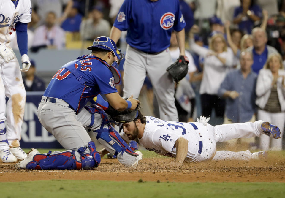 Dodgers' runner Charlie Culberson slides past Cubs catcher Willson Contreras during a controversial play in Game 1 the NLCS. (AP)
