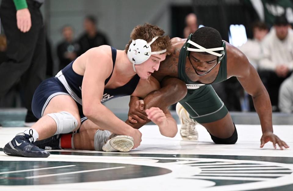 Penn State’s Terrell Barraclough aims to finish off a takedown of Michigan State’s DJ Shannon in their 174-pound bout of the Nittany Lions’ 35-0 win on Sunday at East Lansing, Mich. Barraclough, who filled in for Carter Starocci, beat Shannon, 8-1.