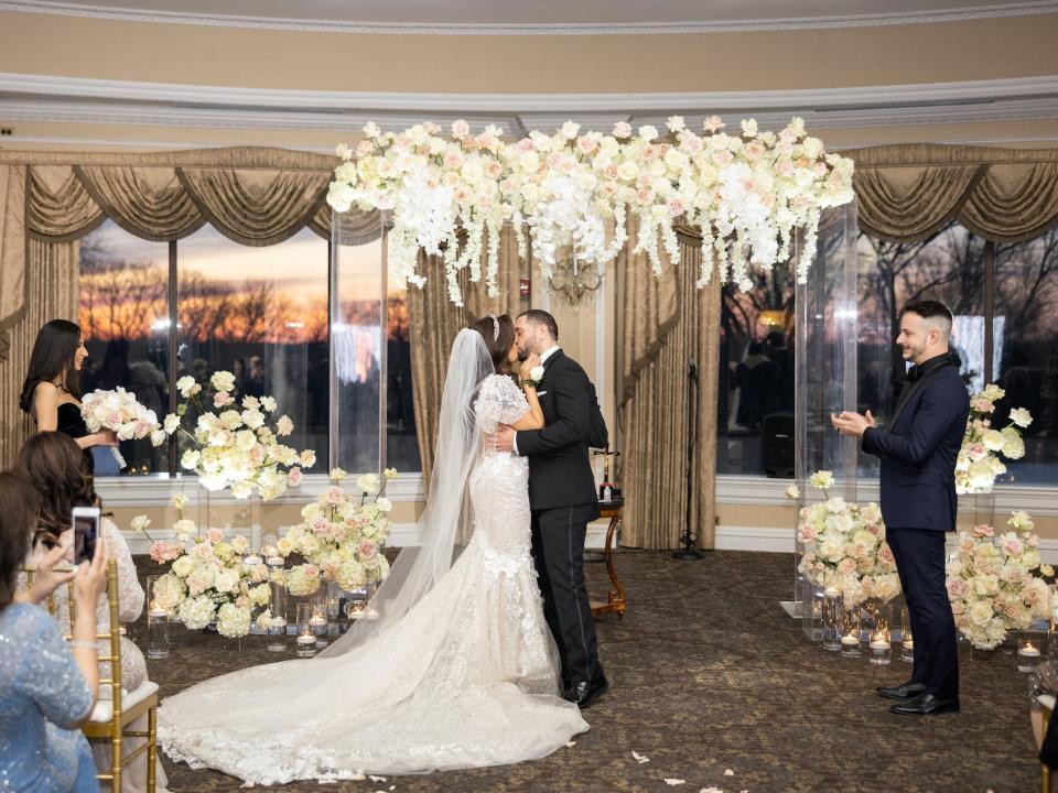 Vishnell and her husband kiss during their wedding ceremony