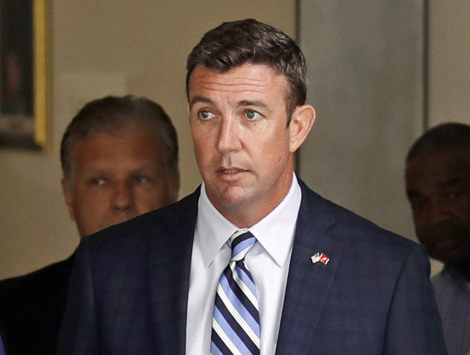 FILE - In this Aug. 23, 2018, file photo, Republican U.S. Rep. Duncan Hunter, R-Calif., leaves an arraignment hearing in San Diego after he and his wife, Margaret, pleaded not guilty to charges they illegally used his campaign account for personal expenses. Federal prosecutors say Hunter illegally used campaign funds to finance romantic flings with a series of women, spending thousands of dollars on meals, drinks and vacations. Allegations about the married Republican congressman's affairs were outlined in a government court filing late Monday, June 24, 2019, connected to charges he and his wife misspent more than $200,000 on trips and personal expenses. (AP Photo/Gregory Bull, File)